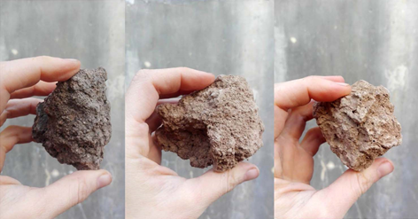 Mano sosteniendo un pan de chocolate  Descripción generada automáticamente con confianza baja